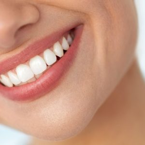 Closeup Of Beautiful Smile With White Teeth. Woman Mouth Smiling